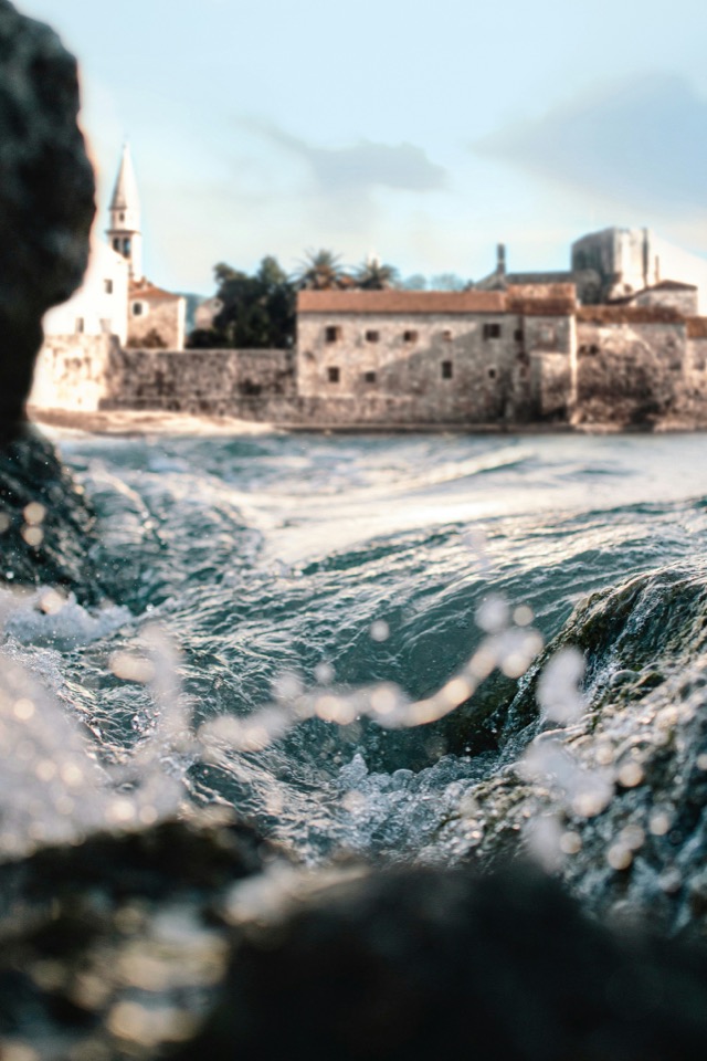 Waves breaking against the old town walls