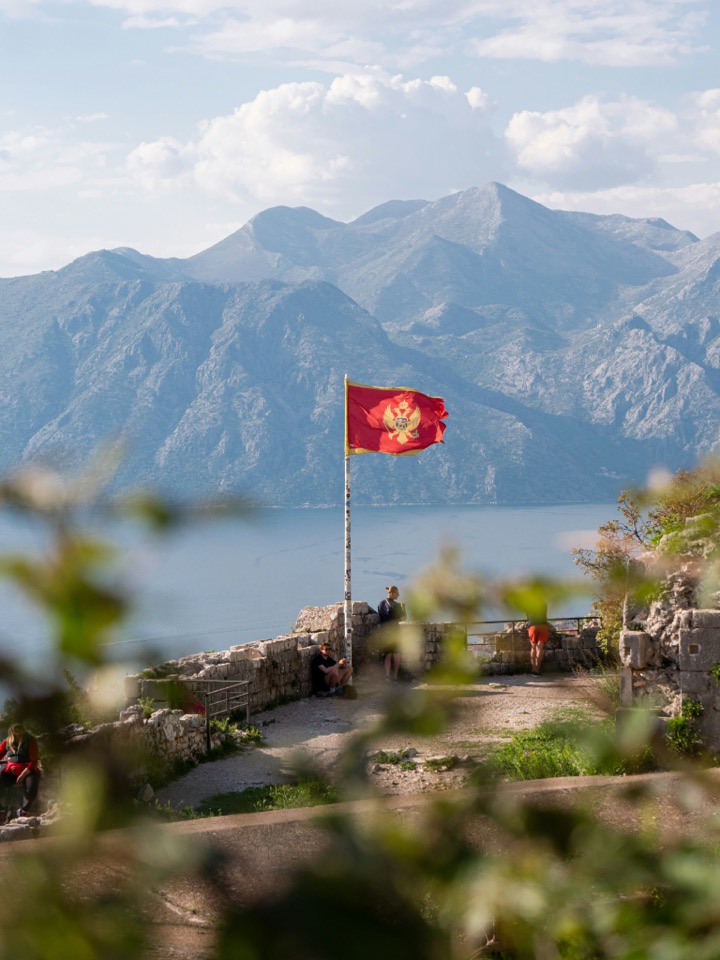 A Montenegrin flag above the mountains