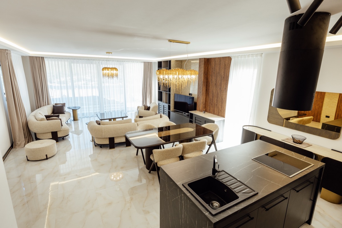 The kitchen island under pendant lighting