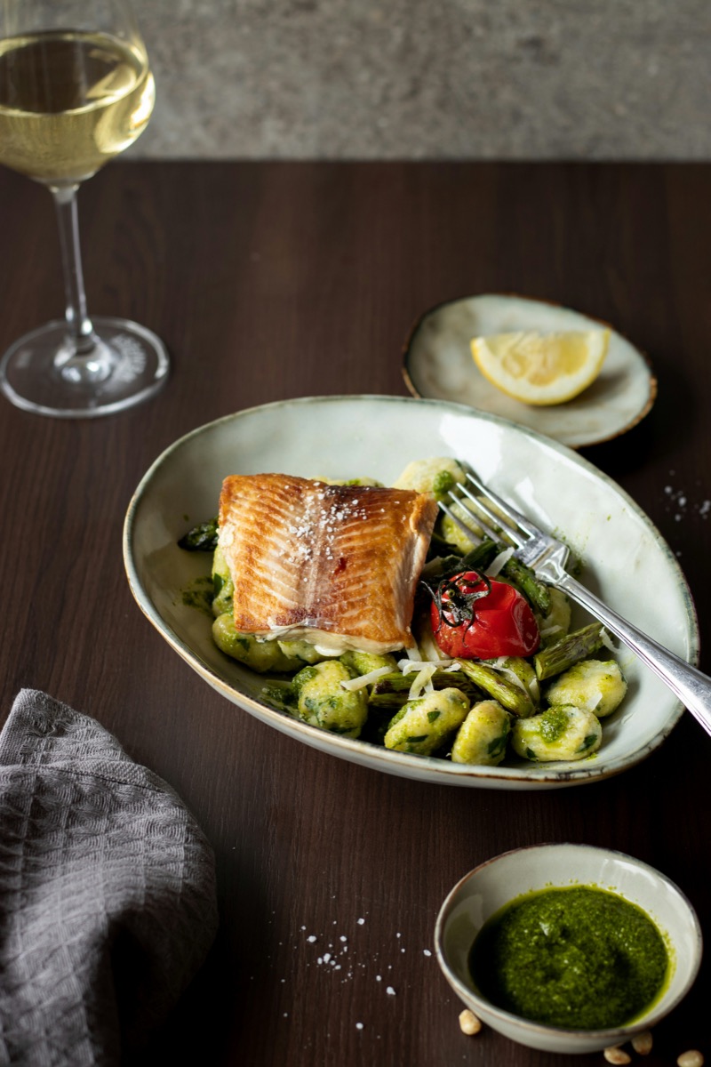 Grilled sea bream with new potatoes on a terrace table